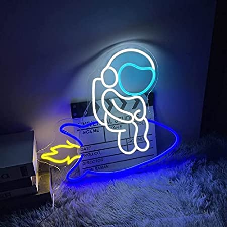 ASTRONAUT SITTING ON ROCKET- Neon Sign